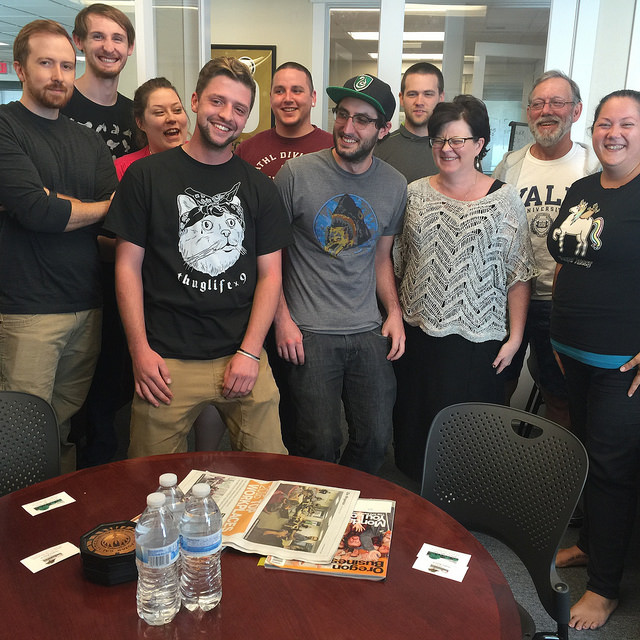 TTR Employees stand with MEDP Executive Director, Jody Christensen, on Cat Shirt Tuesday