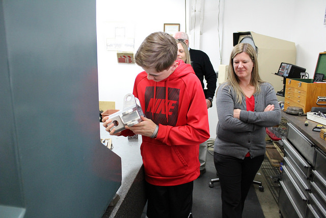  A McMinnville Middle School student holds a piece manufactured by a CNC machine. The students were told the piece would be landing on Mars. 