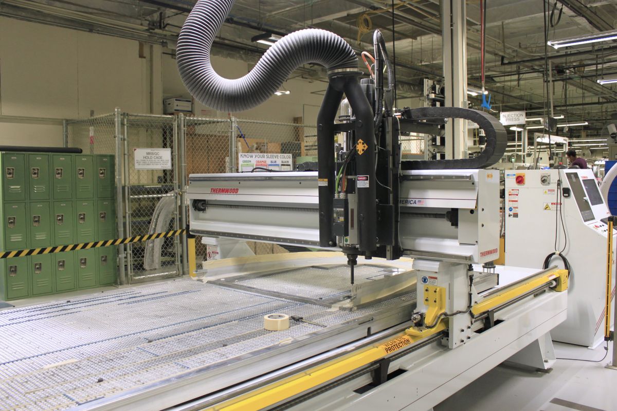 A laser cutter in Meggitt Polymers & Composites, a site MIP helped develop