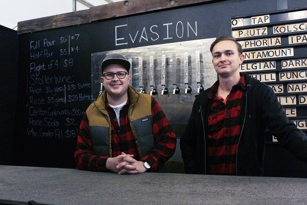 Evasion Brewing President Erik Lapp and VP of Marketing and Sales Evan Lapp behind the bar in the Evasion Tasting Room