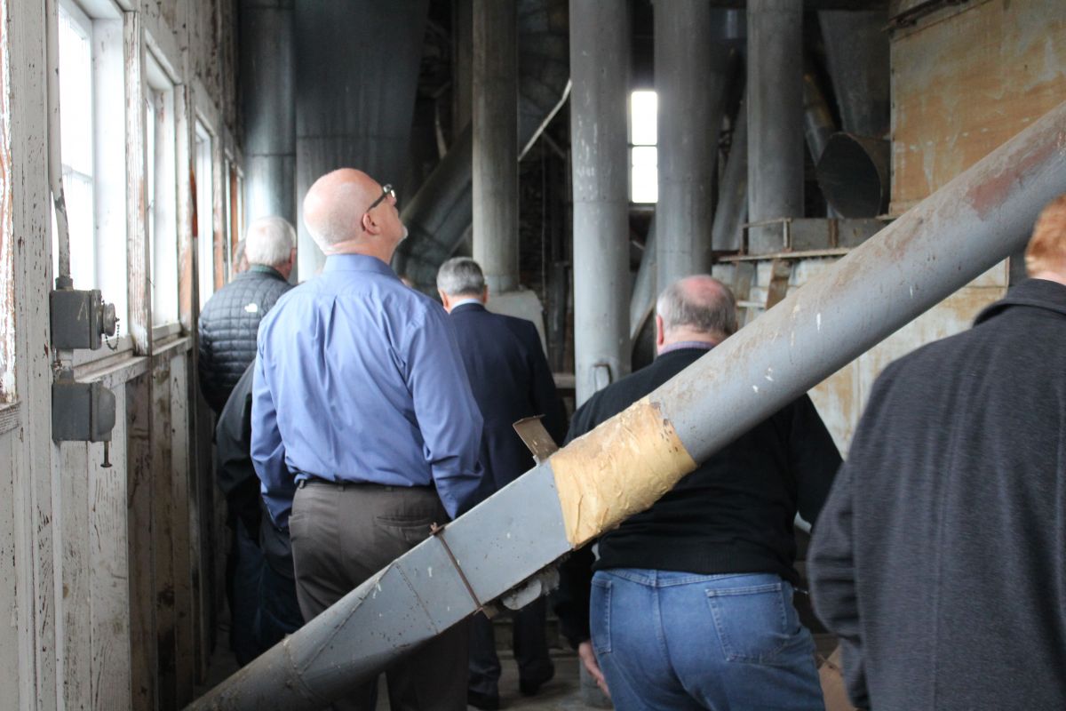 Attendees tour the top floor of the historic Buchanan Cellers building