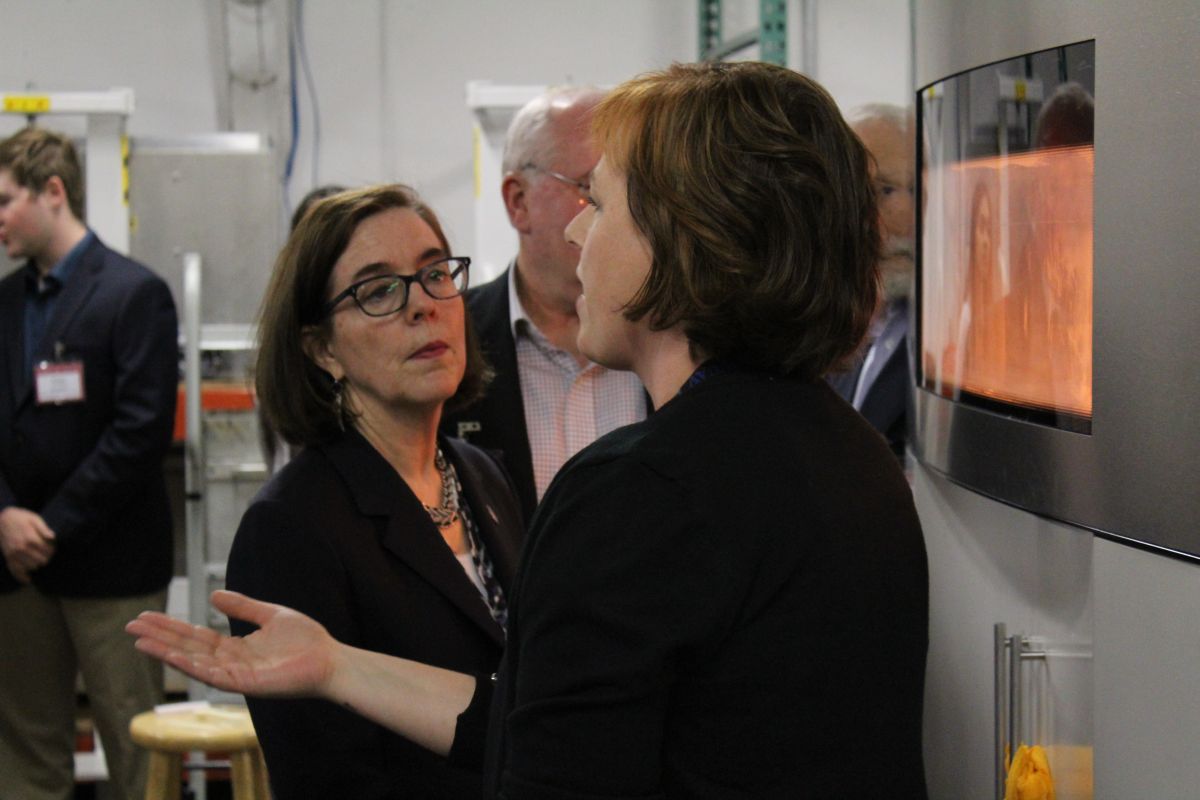 Governor Kate Brown listens to NW Rapid Manufacturing Owner, Heather Harris, explain the SLS (Selective Laser Sintering) Process