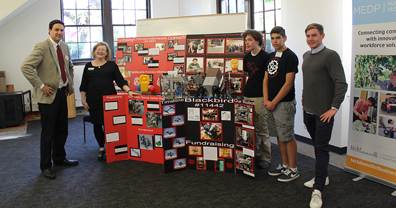 John Tapogna stands with MHS Robotics Team at MEDP Tech Bytes Event