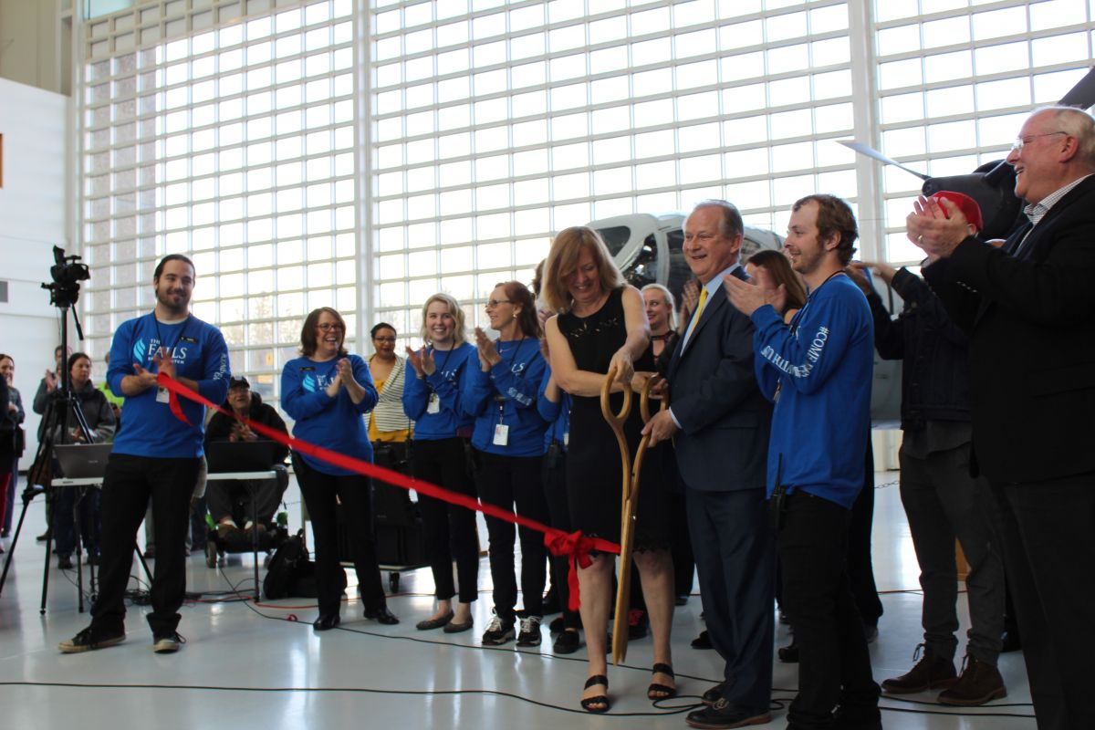 Steve Down, with his wife and son, cut a ribbon to symbolize the grand opening the Falls Event Center in McMinnville, Oregon