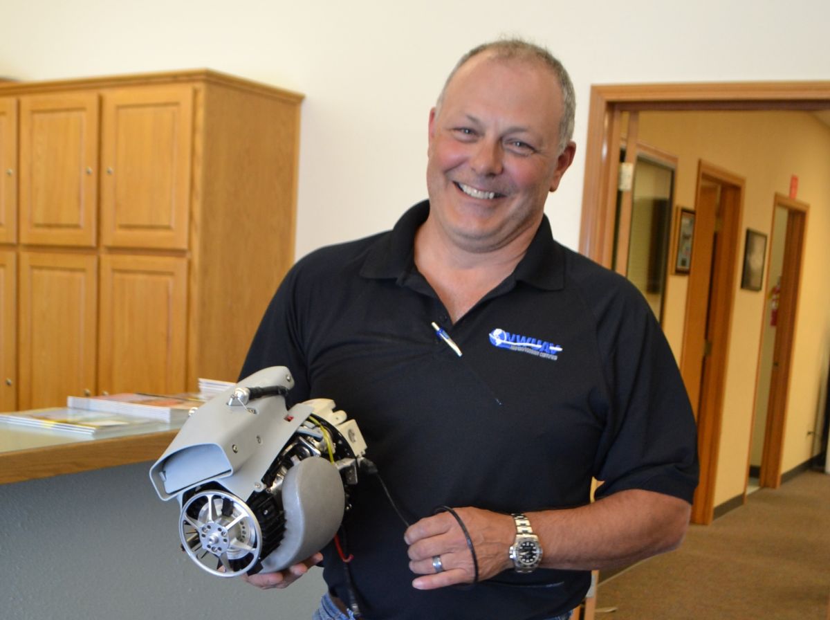 President Chris Harris holding NWUAV’s NW-44 Engine