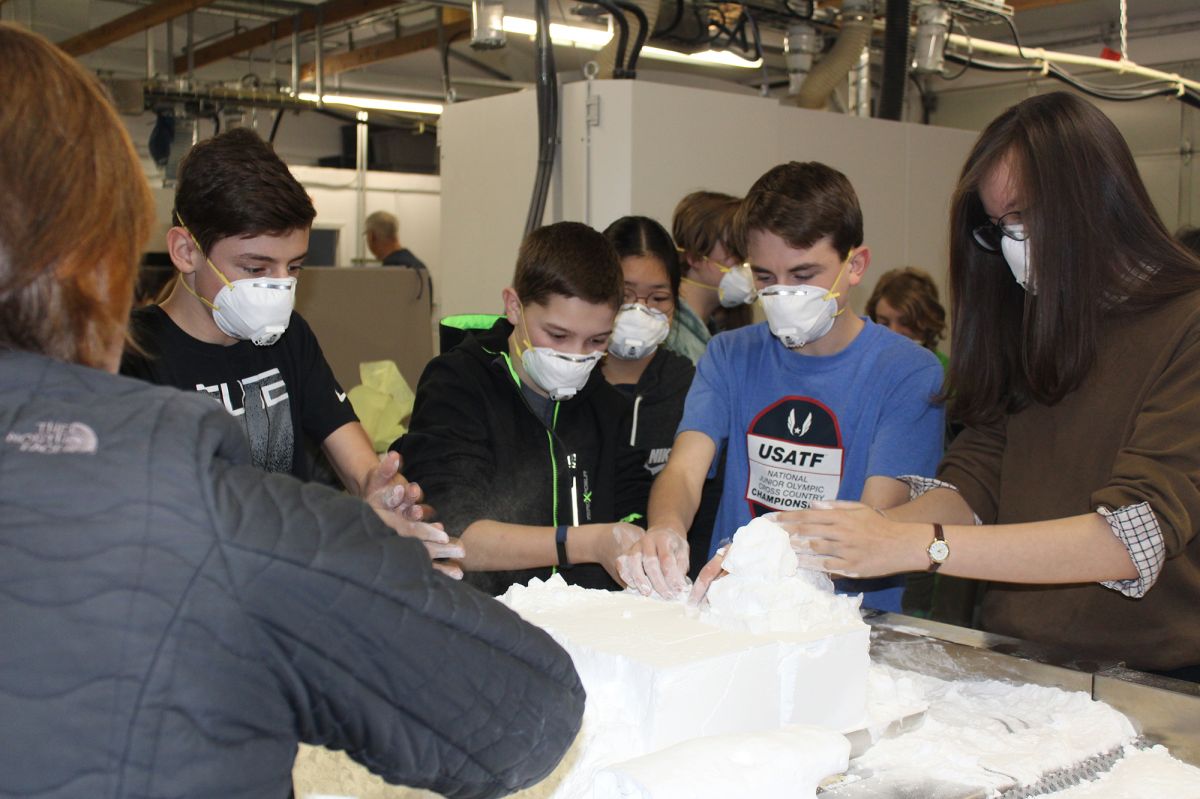 Patton Middle School students search for 3D printed parts at NW Rapid Manufacturing