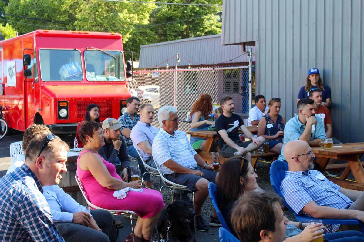 Participants Mingle at the Pub Talk